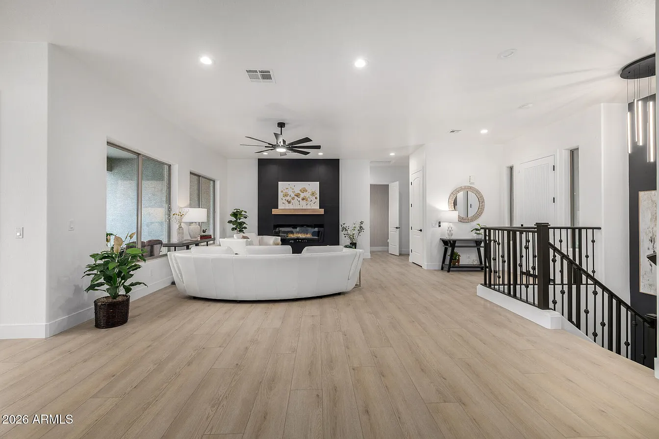 Open living room with fireplace accent wall
