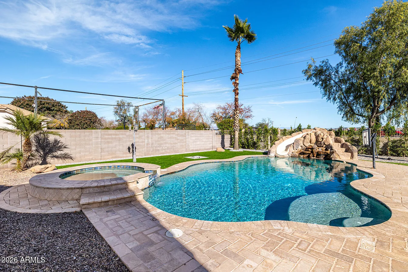 Backyard pool with turf landscaping