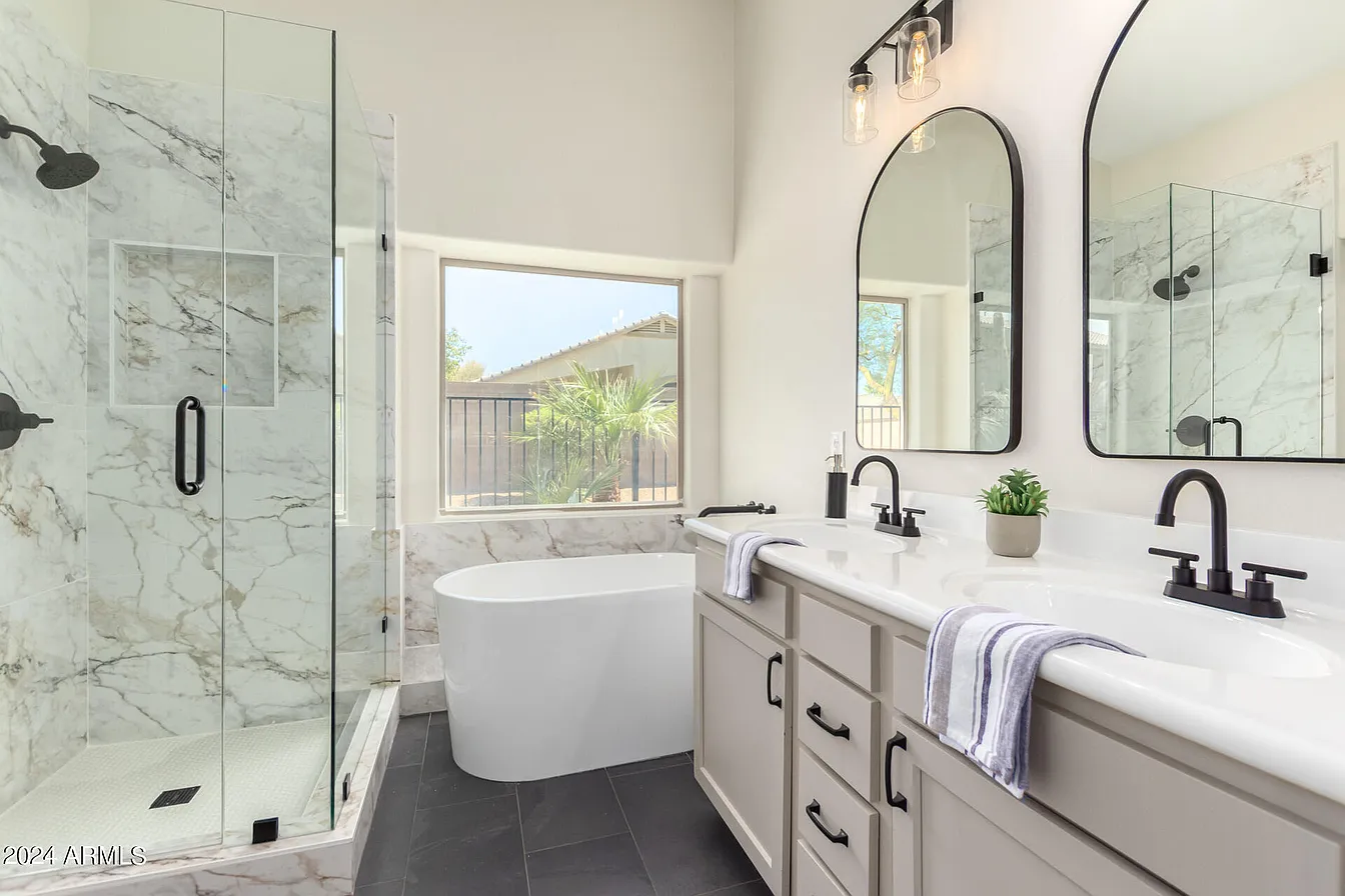 Bathroom with soaking tub and marble shower